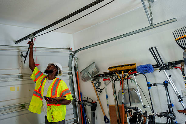 Professional Garage Door Panel Replacement technician working in North Logan, UT
